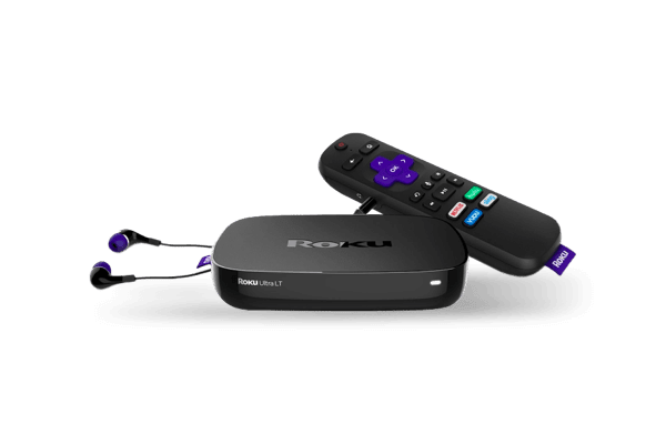 An Roku streaming device alongside its remote control and plugged in headphones.