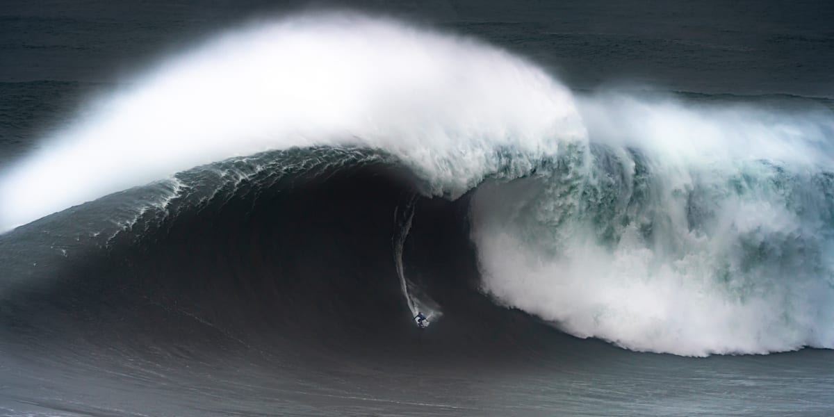 Guy surfing huge wave 2025