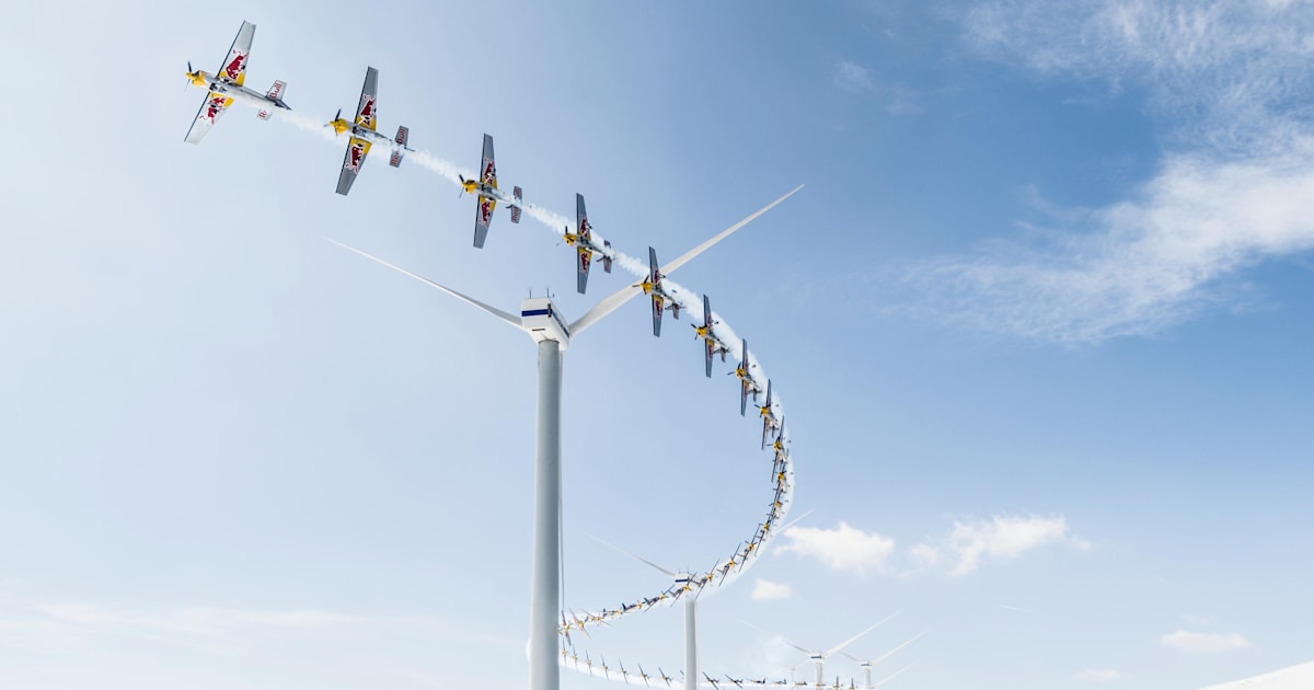 Red Bull Air Race champion slaloms through a wind farm