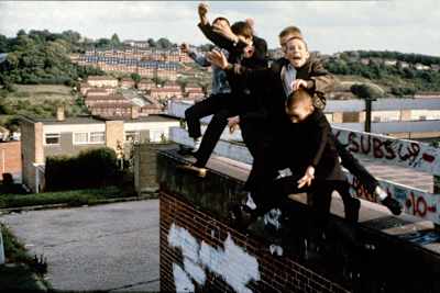 Skinhead boys jumping off a roof, High Wycombe, 1980s