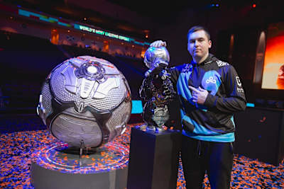 Cloud9 Rocket League player Kyle 'Torment' Storer poses with the RLCS World Championship trophy.