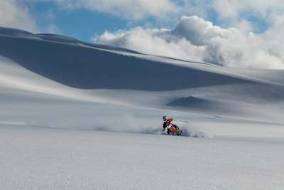 Robbie Maddison on a snowbike