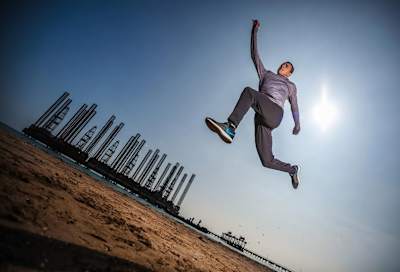 Triple jumper Nazim Babayev in mid-air action.