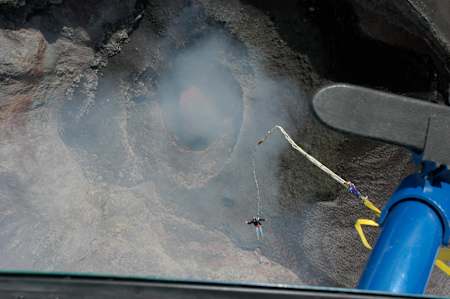A participant bungees into a volcano in Chile.