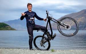 New Zealander George Brannigan as seen alongside his NS Bikes downhill bike in Queenstown, New Zealand.