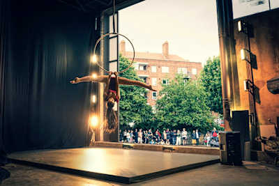 A dancer performs in front of a crowd in London, England.