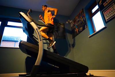 Tom Evans running up a mountain on his treadmill