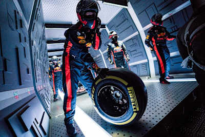 A mechanic holding a wheel during Aston Martin Red Bull Racing’s Zero-G pitstop aboard an aircraft in Russia.