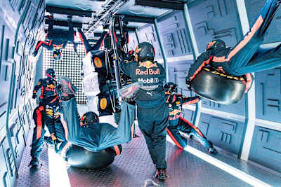 Aston Martin Red Bull Racing’s mechanics pictured performing the Zero-G pit stop aboard an aircraft in Russia.