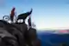 Claudio Caluori and Danny MacAskill stand on top of a mountain taking in the view, Switzerland.