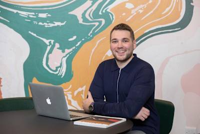 Social media honcho Rob Illidge pictured relaxing in his office