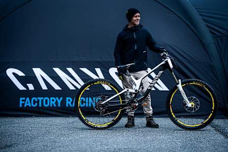 Troy Brosnan and his Canyon Sender MTB in portrait at the Lourdes World Cup in 2017