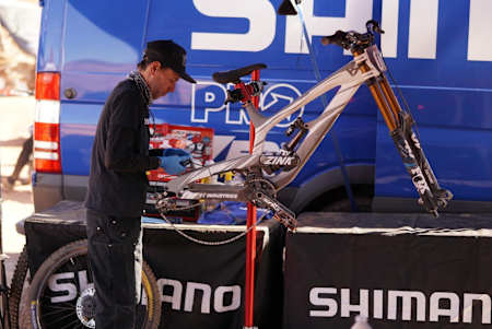 A mechanic works on a Red Bull Rampage 2019 bike.