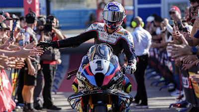 Toprak Razgatlıoğlu is congratulated by fans after winning the 2025 WorldSBK title in Jerez, Spain.