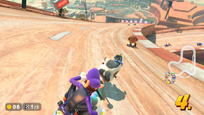 Screenshot aus Mario Kart World zeigt ein Rennen mit der Kuh.