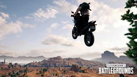 A screenshot of a bike flying through the air in PUBG.