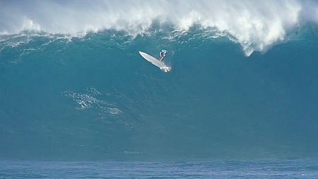 Professional big wave surfer Keala Kennelly wipes out while surfing a huge day at Jaws, Maui, Hawaii.