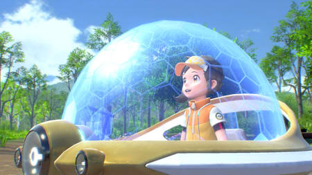 Ein Mädchen sitzt in einem runden Gefährt mit kuppelartigem Schutzschild