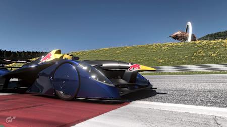 Screenshot aus Gran Turismo 7 zeigt den Red Bull X2014 vor der Bullen-Statue am Red Bull Ring.