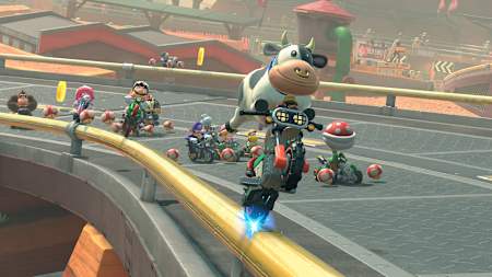 Une vache grind sur un rail dans jeu Mario Kart World sur Nintendo Switch 2.