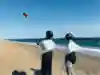 A kitesurfing instructor teaches a lesson.