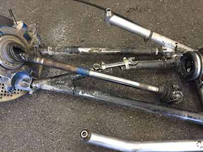 Note the spanner holding the suspension together