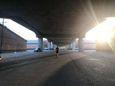 Rickey Gates runs under a flyover in San Francisco during his 46 day marathon to run every single street in the Californian city.