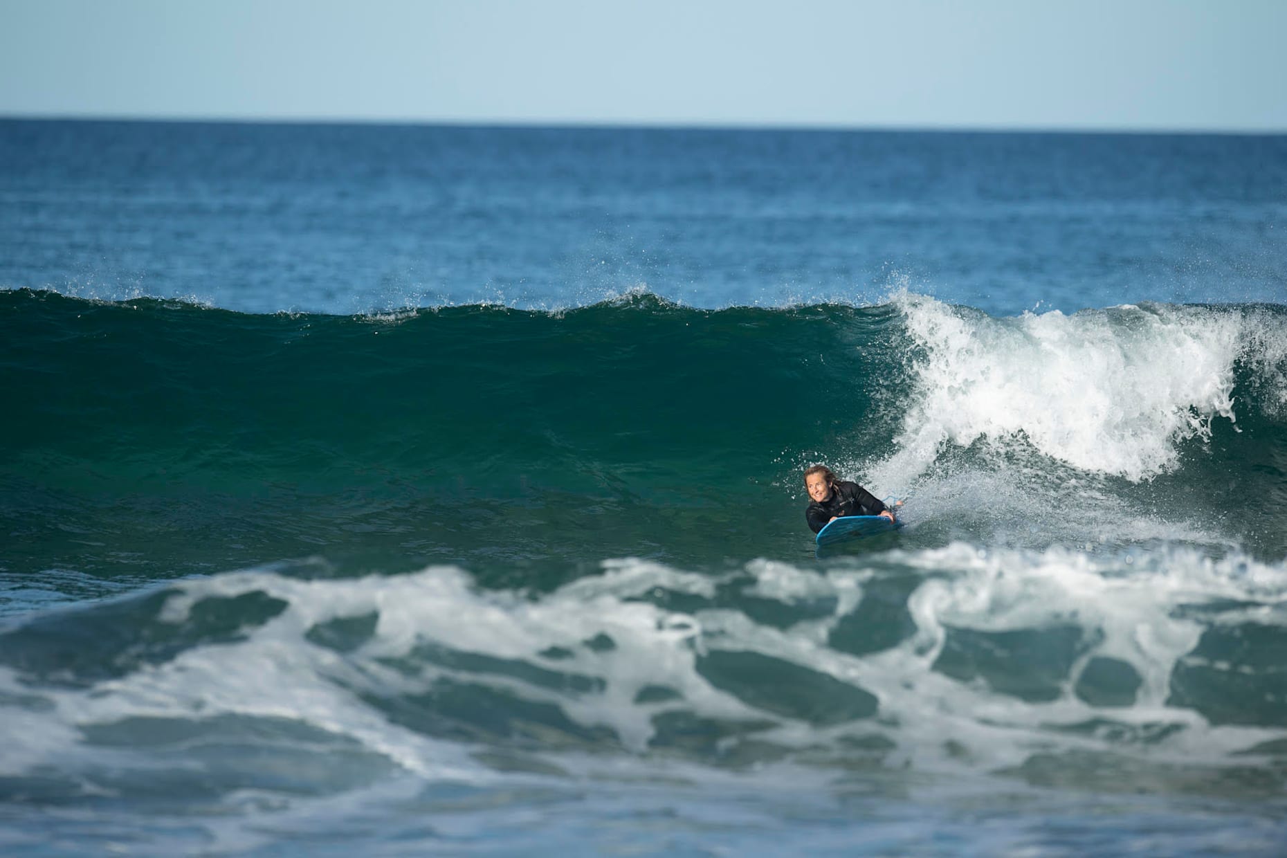 Two-time para surfing world champion Sam Bloom pictured surfing at home in Australia.