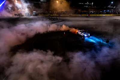 A photo of a competitor burning rubber during Red Bull Car Park Drift in Amman, Jordan on August 16, 2019.