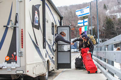 Zeb Powell picks up Miles Fallon and Benny Milam near Loon Mountain Resort during the Red Bull Slide In Tour 2020. 
