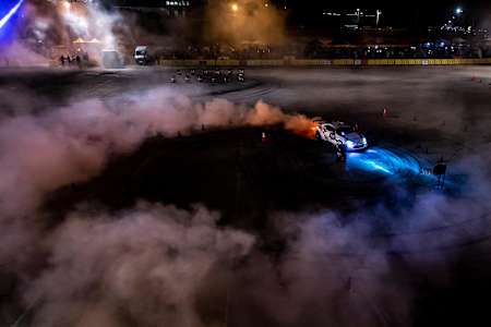 A photo of a competitor burning rubber during Red Bull Car Park Drift in Amman, Jordan on August 16, 2019.