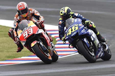 Marc Márquez duels with Valentino Rossi at the 2018 Argentine Grand Prix. The Spaniard and Italian sit atop the MotoGP leaderboard with six world titles apiece.