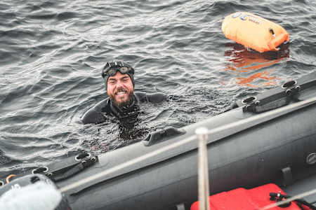 Ross Edgley takes a momentary break from swimming in John O'Groats during his Great British Swim attempt.