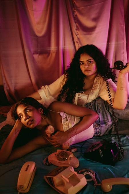 Ramya Pothuri and Tanya Shah of Water & Rum with phones.