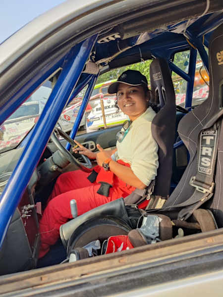 Rally driver Athira Murali seen in her rally car.
