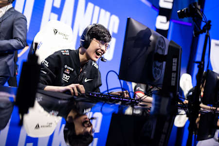 Edward Gaming's Zhao "Jiejie" Li-Jie celebrates a quarter-final victory after five tense games against Royal Never Give Up.
