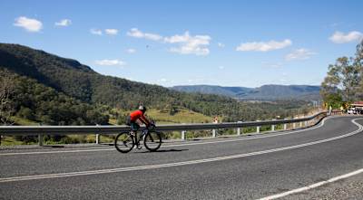 Arunaabh Shah cycles down a road in India.