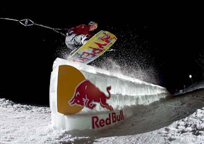JD Webb wakeboards an ice rail in Minnesota, USA in a photograph shot by Ryan Taylor.