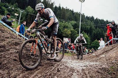 Mathieu Van der Poel leads out Henrique Avancini during the XCC race at the UCI XCO World Cup at Val di Sole, Italy,  on August 2, 2019.