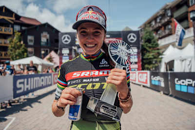 Kate Courtney holding the Overall Title trophy at Snowshoe Bike Park in West Virginia, USA.