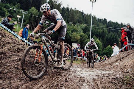 Mathieu Van der Poel leads out Henrique Avancini during the XCC race at the UCI XCO World Cup at Val di Sole, Italy,  on August 2, 2019.