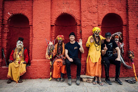 Rob Warner and Olly Wilkins pose with local religious men outside a Buddhist monastery in the Mustang Region of Nepal