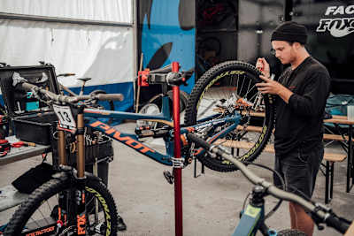 Mechanic Kurt McDonald works on a Pivot bike.