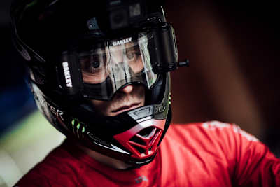 A close-up profile of Amaury Pierron in helmet and goggles.