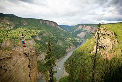 Aniol Serrasolses stands looking down into the Stikine river in Canada, British Columbia.