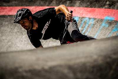 Andrew Neethling banks on a pump track turn.