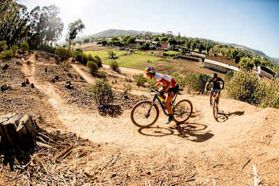 XCO pro Bianca Haw leads Olvier Munnik up a climb on Coetzenberg’s World Cup XCO Track in South Africa.