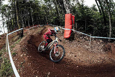 Myriam Nicole rides a berm during La Bresse practice.