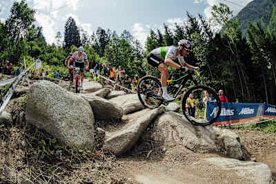 Henrique Avancini leads a group of riders during the XCO race at the UCI XCO World Cup at Val di Sole, Italy, on August 4, 2019.