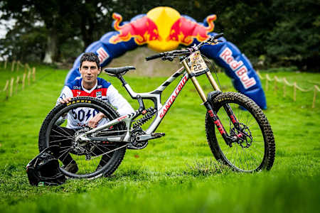 Josh Bryceland poses beside his bike at Red Bull Hardline in Dinas Mawddwy, Wales on September 14th 2018.